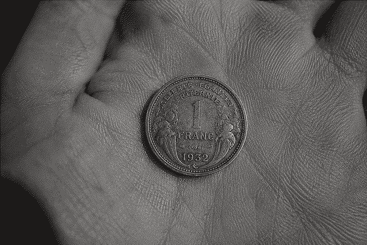 A 1932 French one-franc coin, held in an open palm